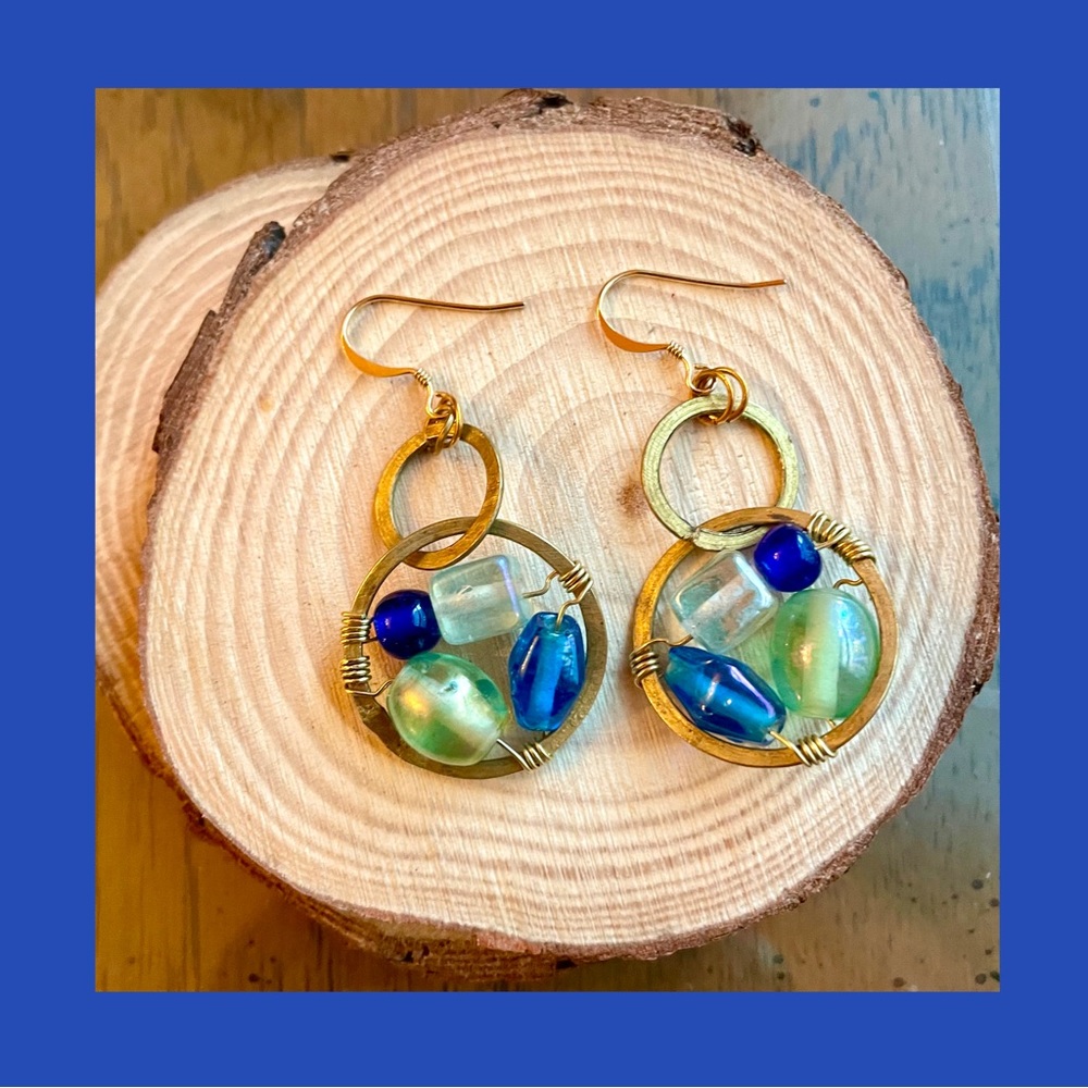 Handmade brass and wire wrapped glass bead earrings in blue and green